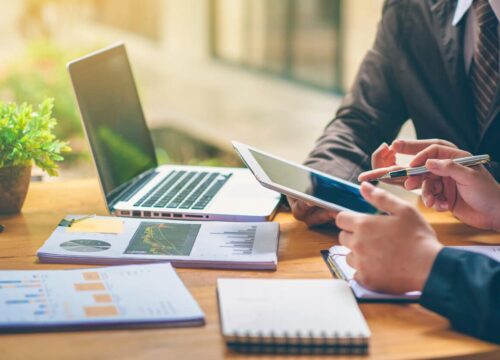 Business people are analyzing and planning business. Business Strategy Consulting